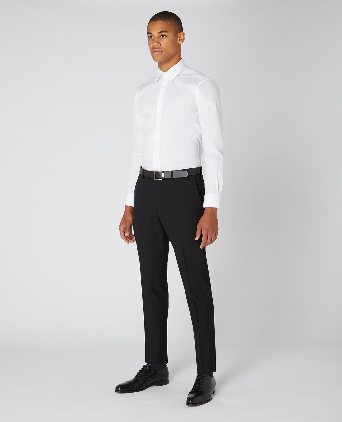 Man wearing a black Tapered Fit Formal Trousers
