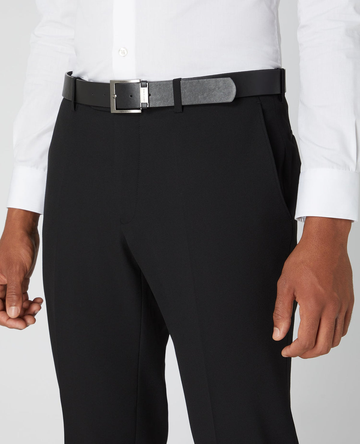 Man wearing a black Tapered Fit Formal Trousers