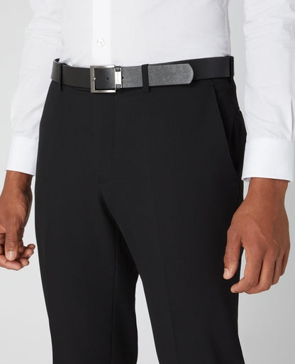 Man wearing a black Tapered Fit Formal Trousers