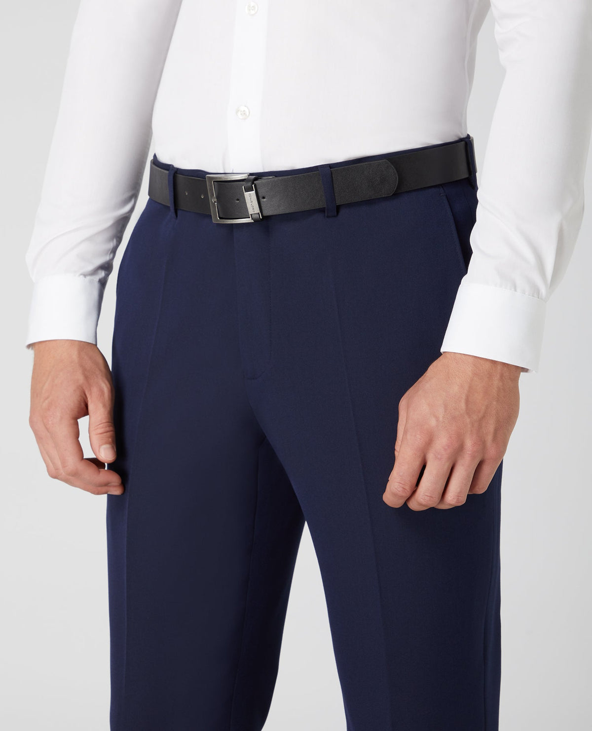 Man wearing a navy Tapered Fit Formal Trousers