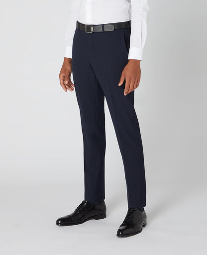 Man wearing a navy Tapered Fit Formal Trousers