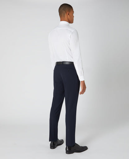 Man wearing a navy Tapered Fit Formal Trousers