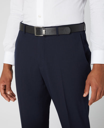 Man wearing a navy Tapered Fit Formal Trousers
