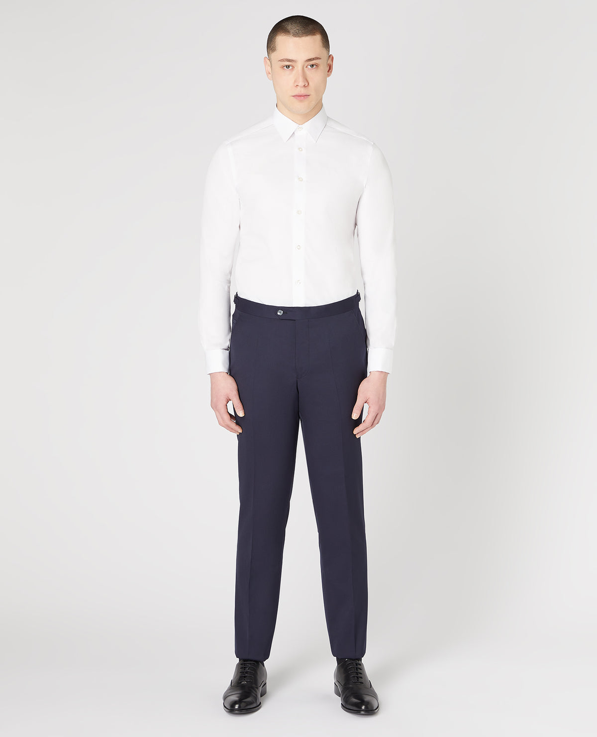 Man wearing a navy Slim Fit Wool-Rich Mix and Match Dinner Suit Trousers