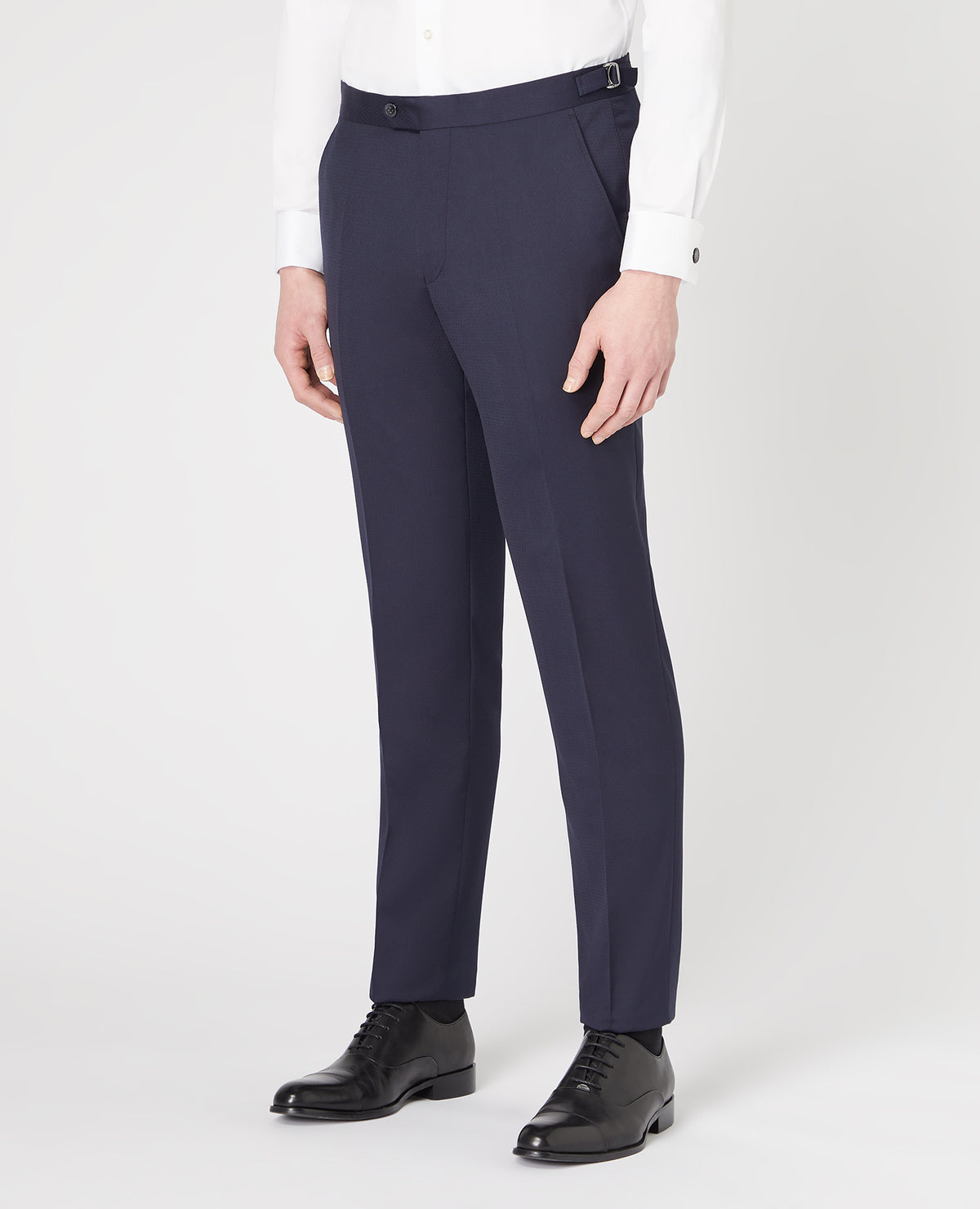 Man wearing a navy Slim Fit Wool-Rich Mix and Match Dinner Suit Trousers