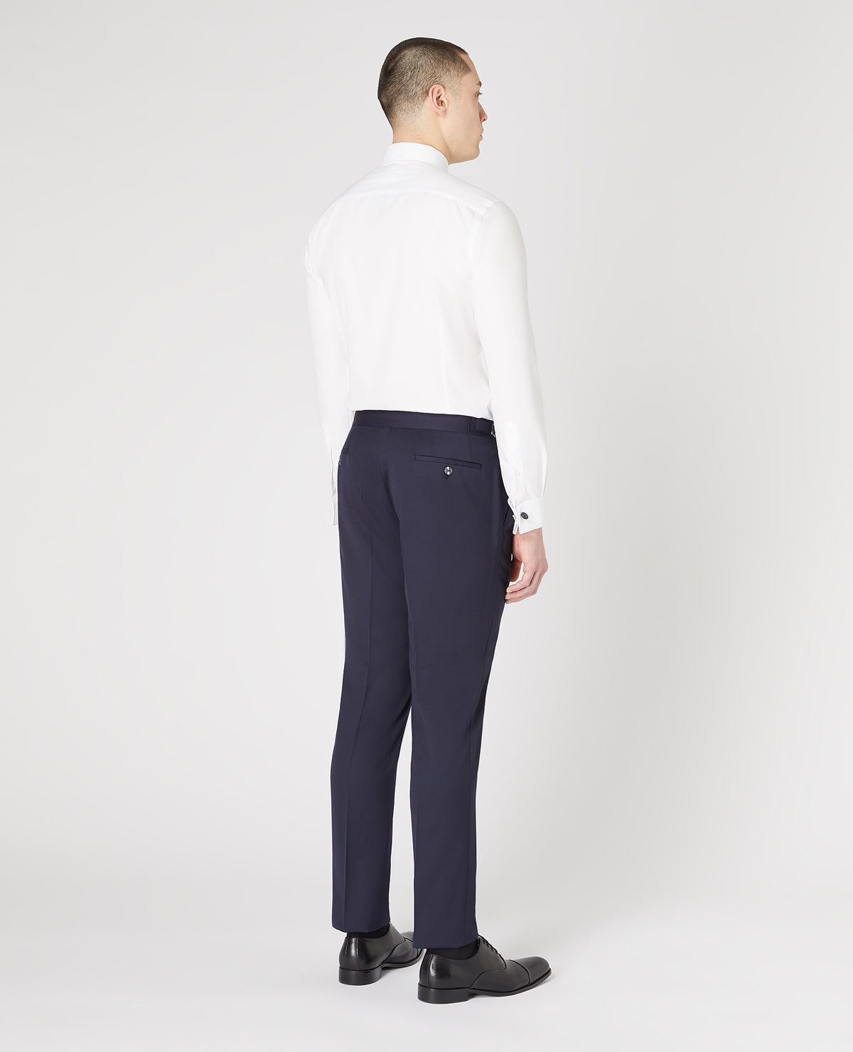 Man wearing a navy Slim Fit Wool-Rich Mix and Match Dinner Suit Trousers