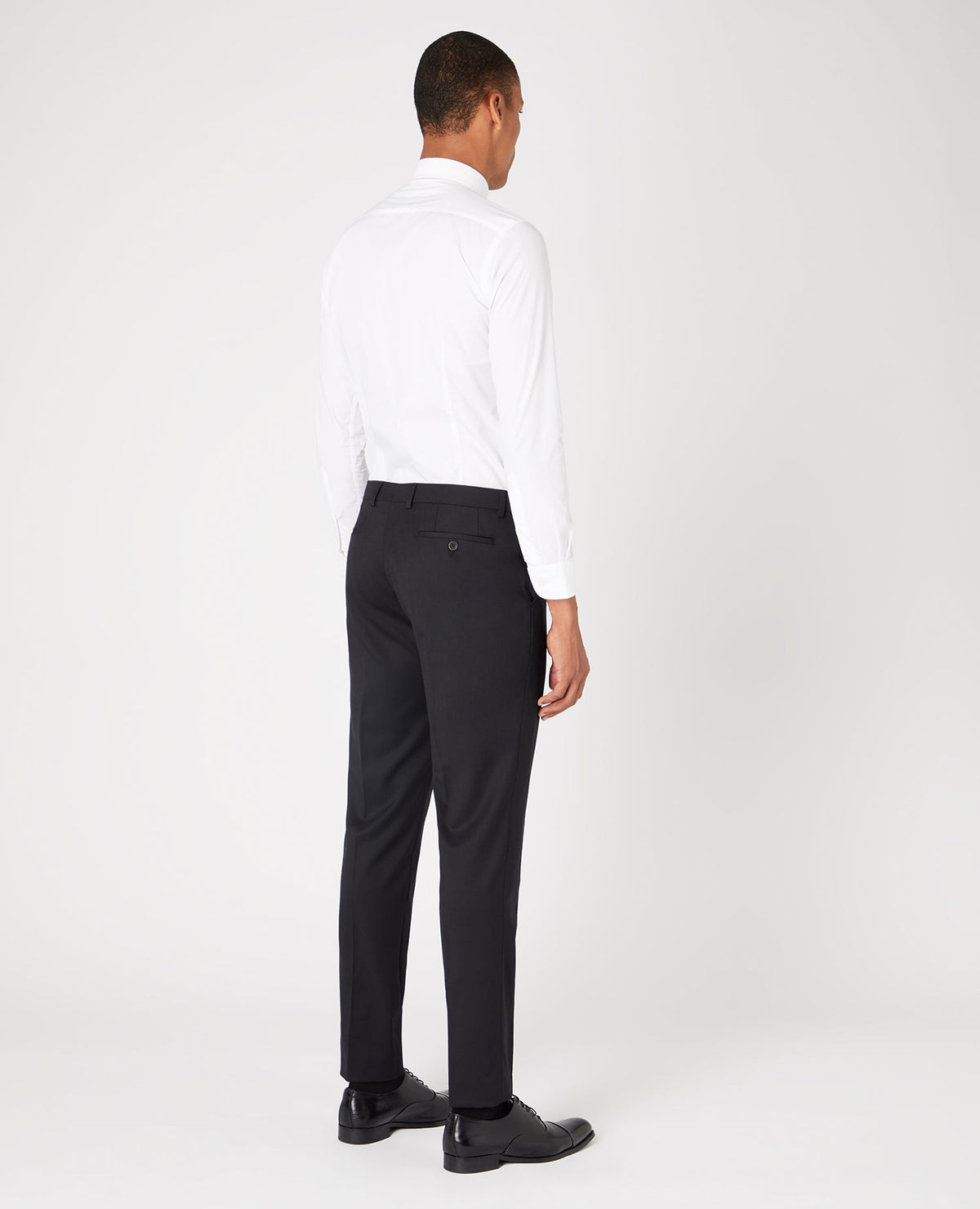 Man wearing a black Slim Fit Wool-Blend Stretch Mix and Match Trousers