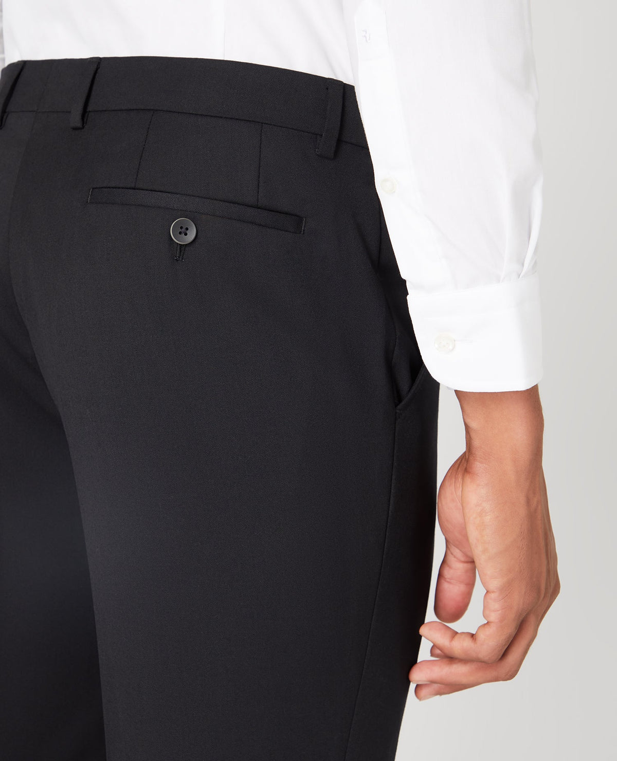 Man wearing a black Slim Fit Wool-Blend Stretch Mix and Match Trousers