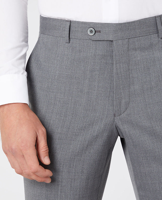 Man wearing a grey Tapered Fit Wool-Blend Stretch Mix and Match Suit Trousers