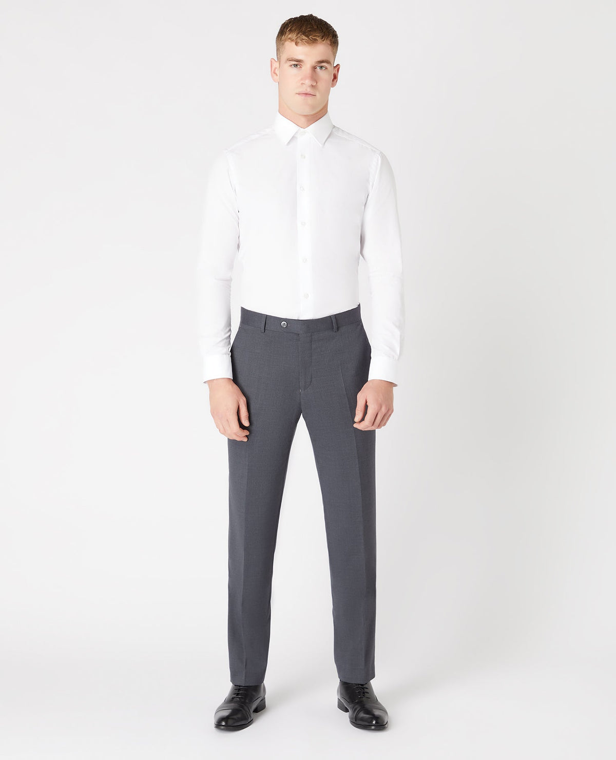 Man wearing a grey Tapered Fit Wool-Blend Stretch Mix and Match Suit Trousers