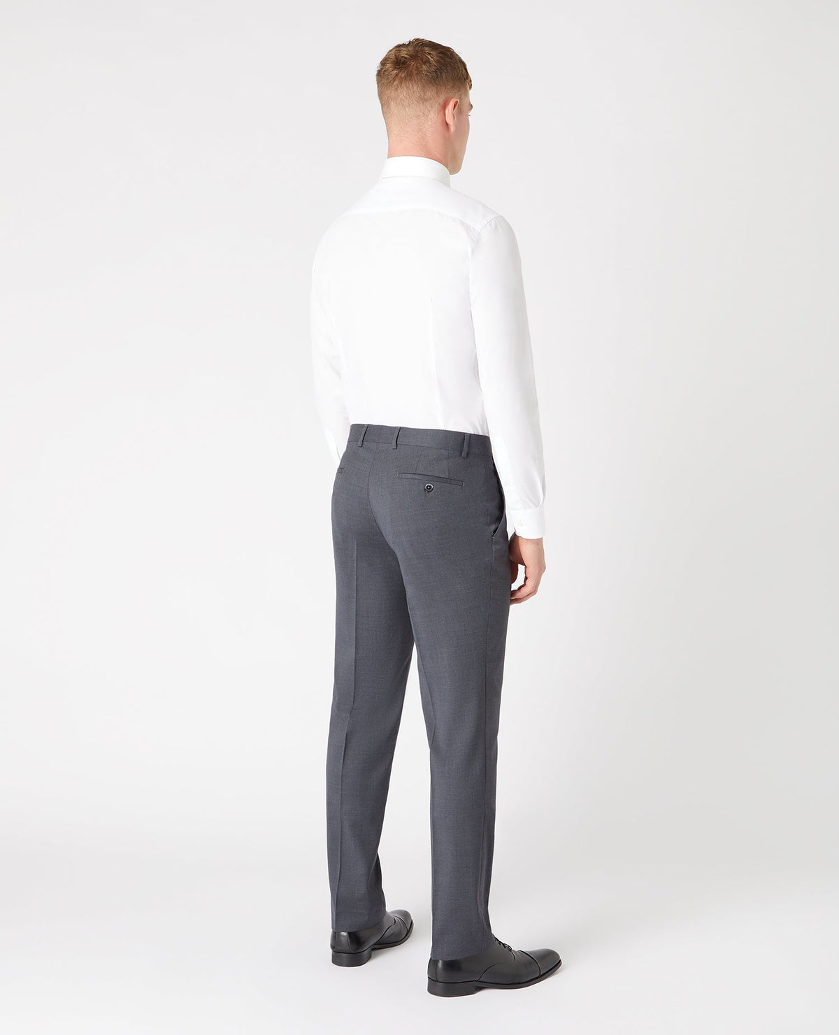Man wearing a grey Tapered Fit Wool-Blend Stretch Mix and Match Suit Trousers