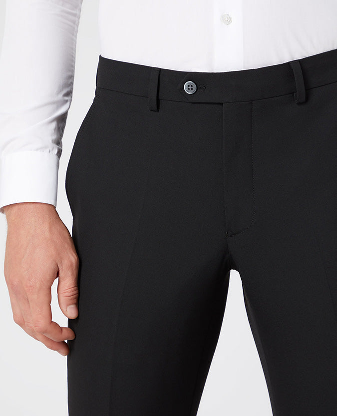 Man wearing a black X-Slim Leg Stretch Formal Trousers