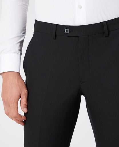 Man wearing a black X-Slim Leg Stretch Formal Trousers