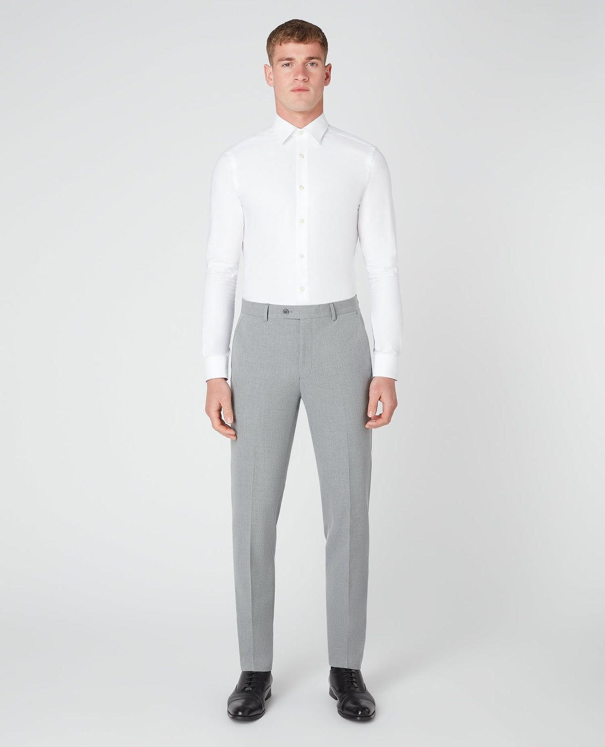 Man wearing a grey X-Slim Leg Stretch Formal Trousers