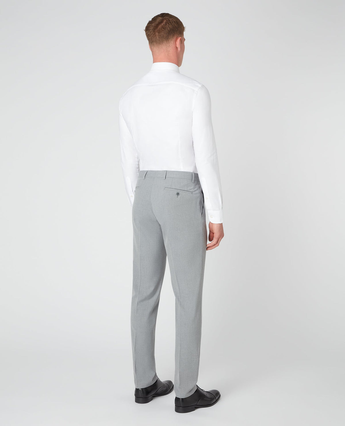 Man wearing a grey X-Slim Leg Stretch Formal Trousers