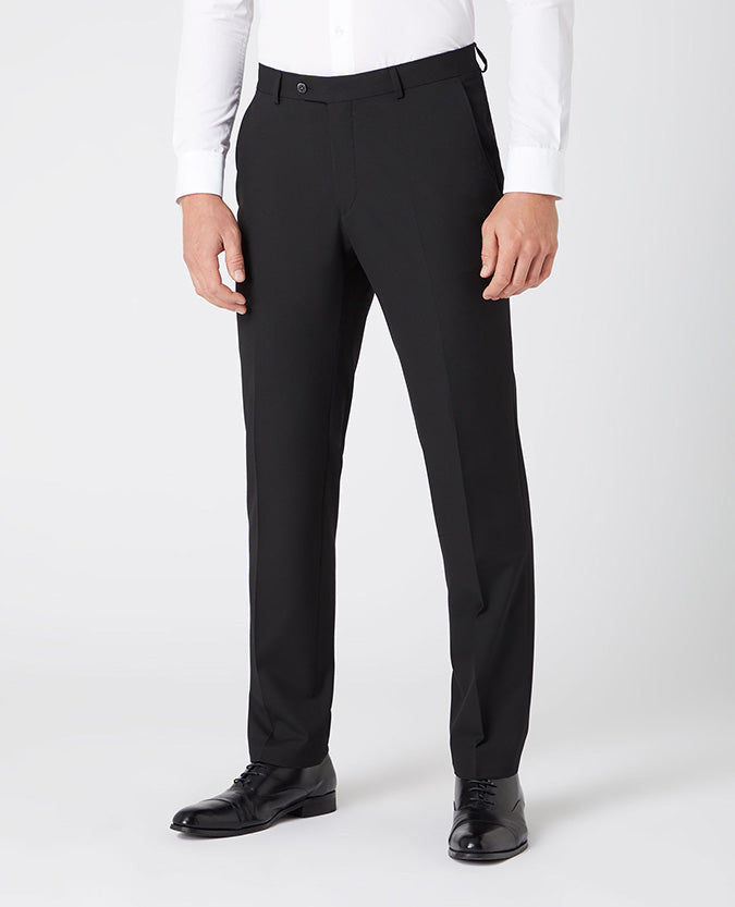 Man wearing a black Tapered Leg Stretch Formal Trousers .