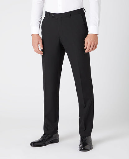 Man wearing a black Tapered Leg Stretch Formal Trousers .