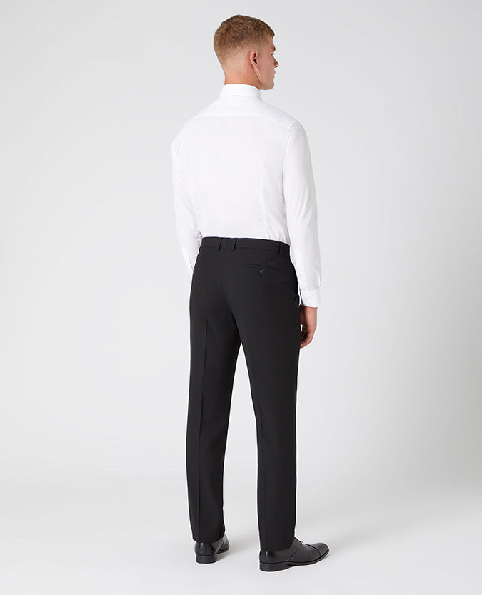 Man wearing a black Tapered Leg Stretch Formal Trousers .