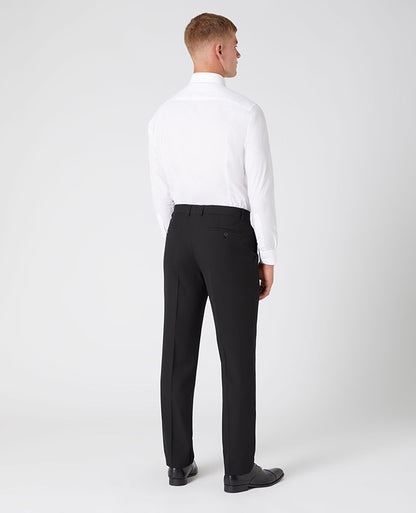 Man wearing a black Tapered Leg Stretch Formal Trousers .