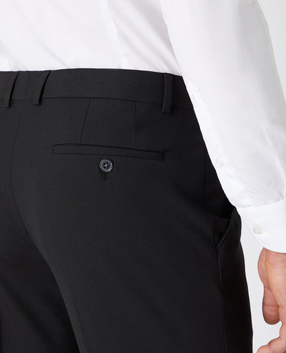 Man wearing a black Tapered Leg Stretch Formal Trousers .