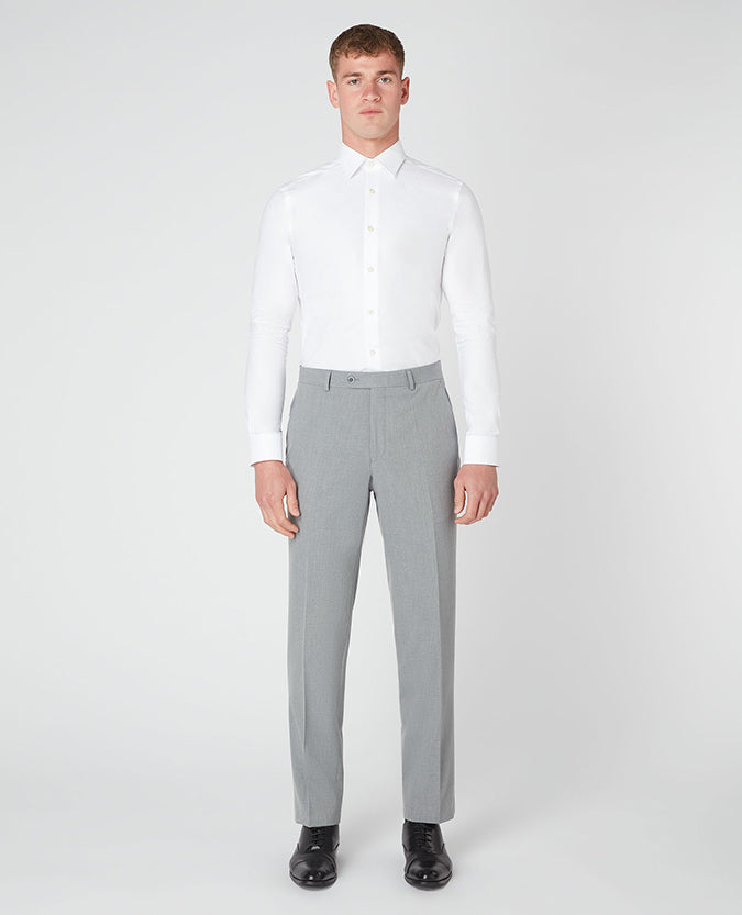 Man wearing a grey Tapered Leg Stretch Formal Trousers .