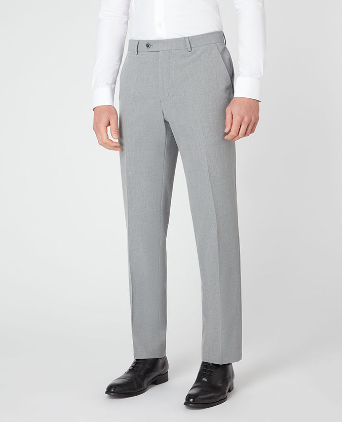 Man wearing a grey Tapered Leg Stretch Formal Trousers .