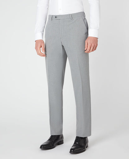 Man wearing a grey Tapered Leg Stretch Formal Trousers .