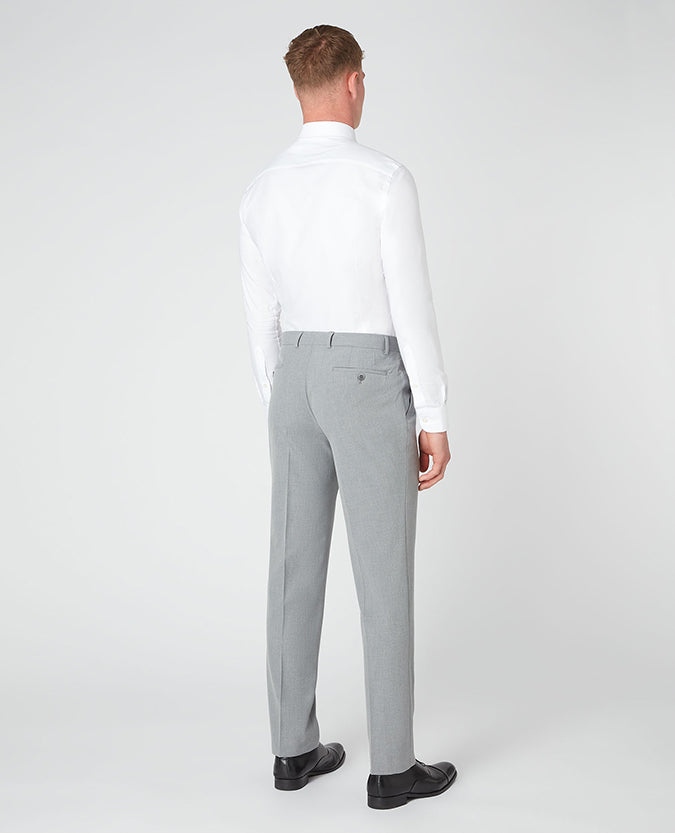 Man wearing a grey Tapered Leg Stretch Formal Trousers .