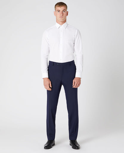 Man wearing a navy Tapered Leg Stretch Formal Trousers .