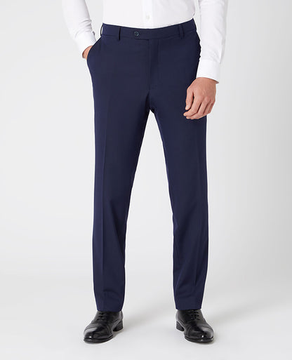Man wearing a navy Tapered Leg Stretch Formal Trousers .