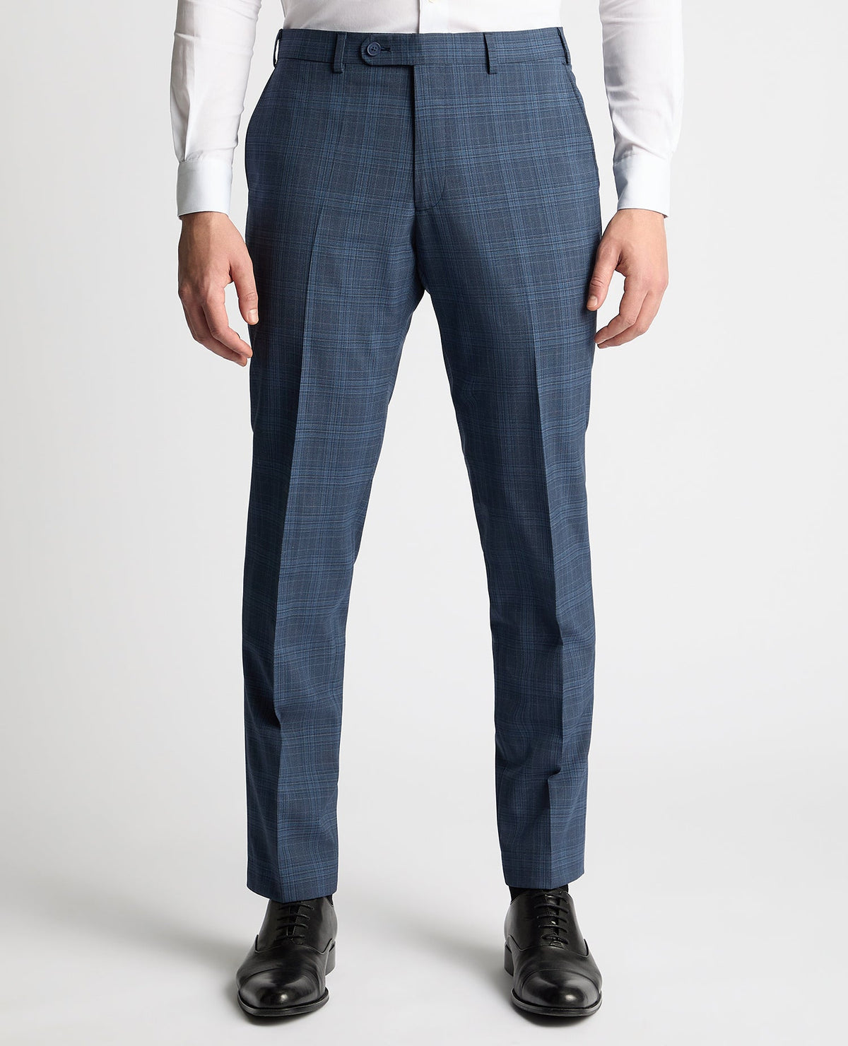 Man wearing a blue Tapered Fit Checked Wool Blend Mix and Match Suit Trouser