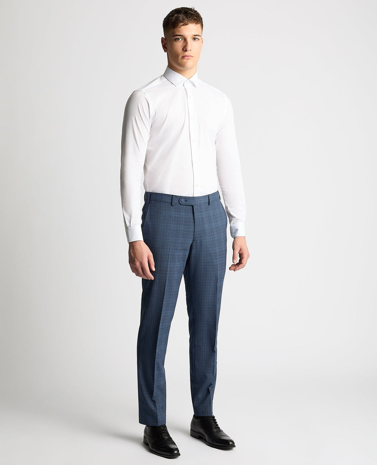 Man wearing a blue Tapered Fit Checked Wool Blend Mix and Match Suit Trouser