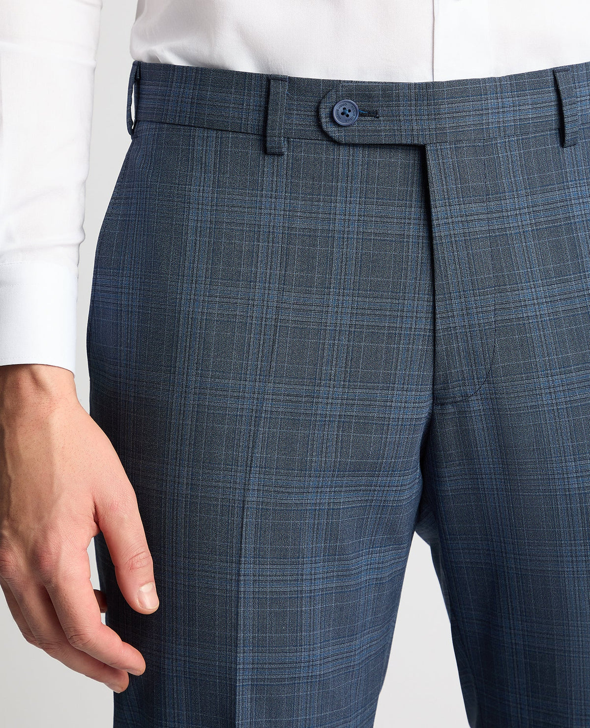 Man wearing a blue Tapered Fit Checked Wool Blend Mix and Match Suit Trouser