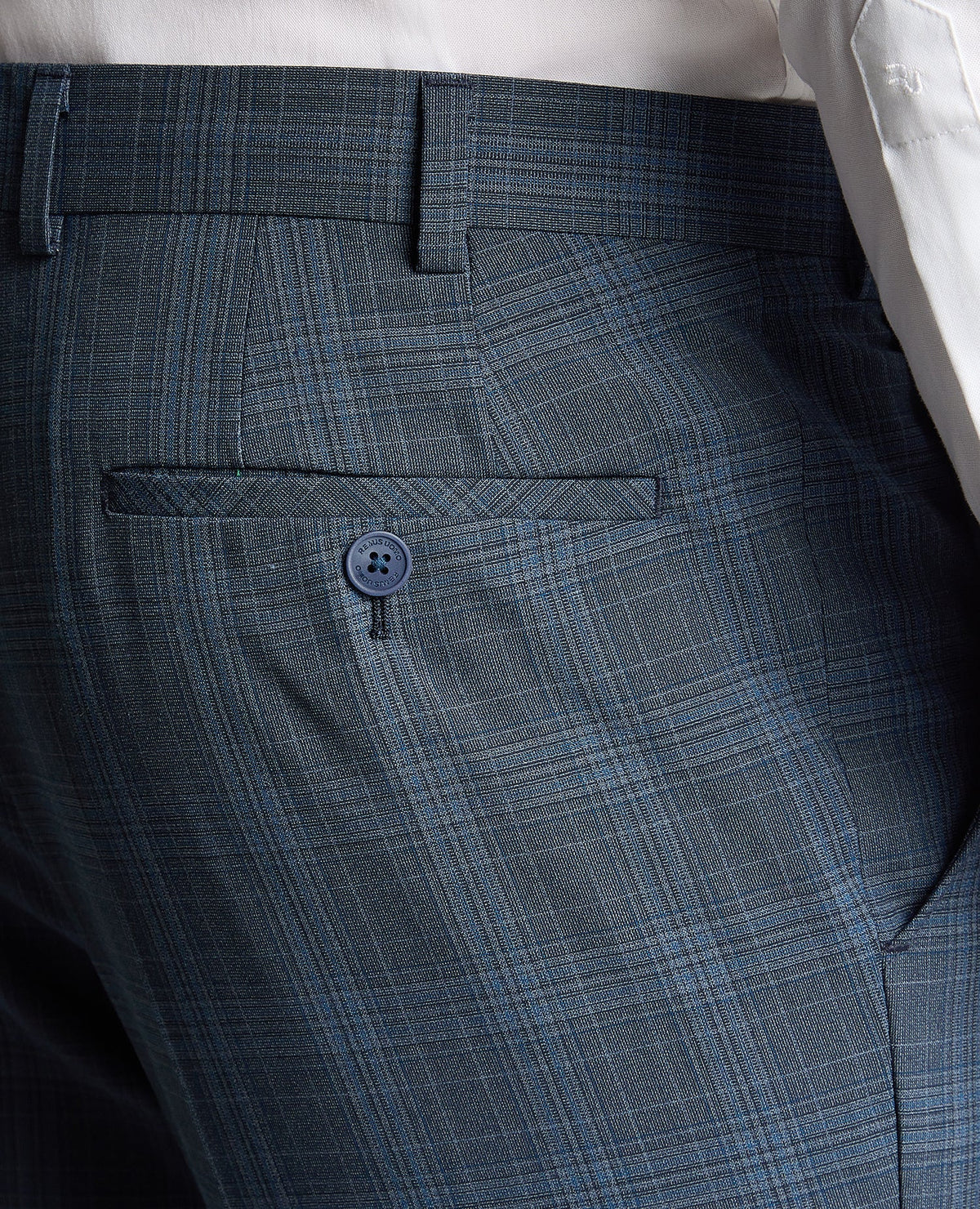 Man wearing a blue Tapered Fit Checked Wool Blend Mix and Match Suit Trouser