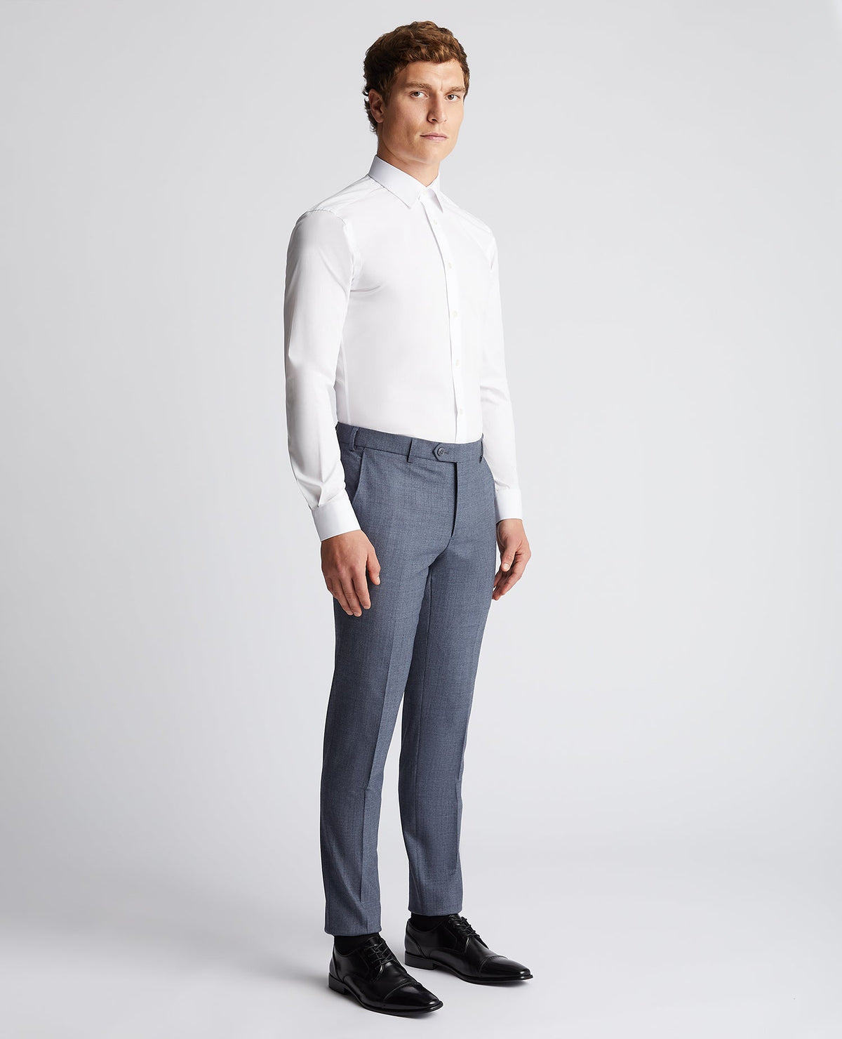 Man wearing a blue X-Slim Fit Wool Blend Mix And Match Suit Trouser