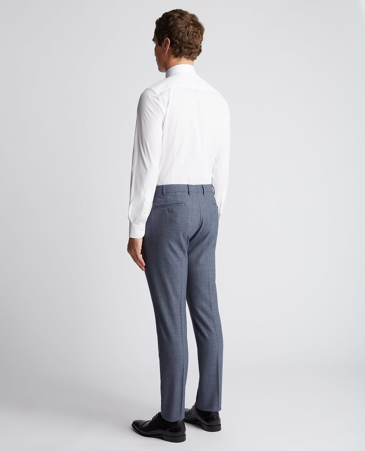 Man wearing a blue X-Slim Fit Wool Blend Mix And Match Suit Trouser