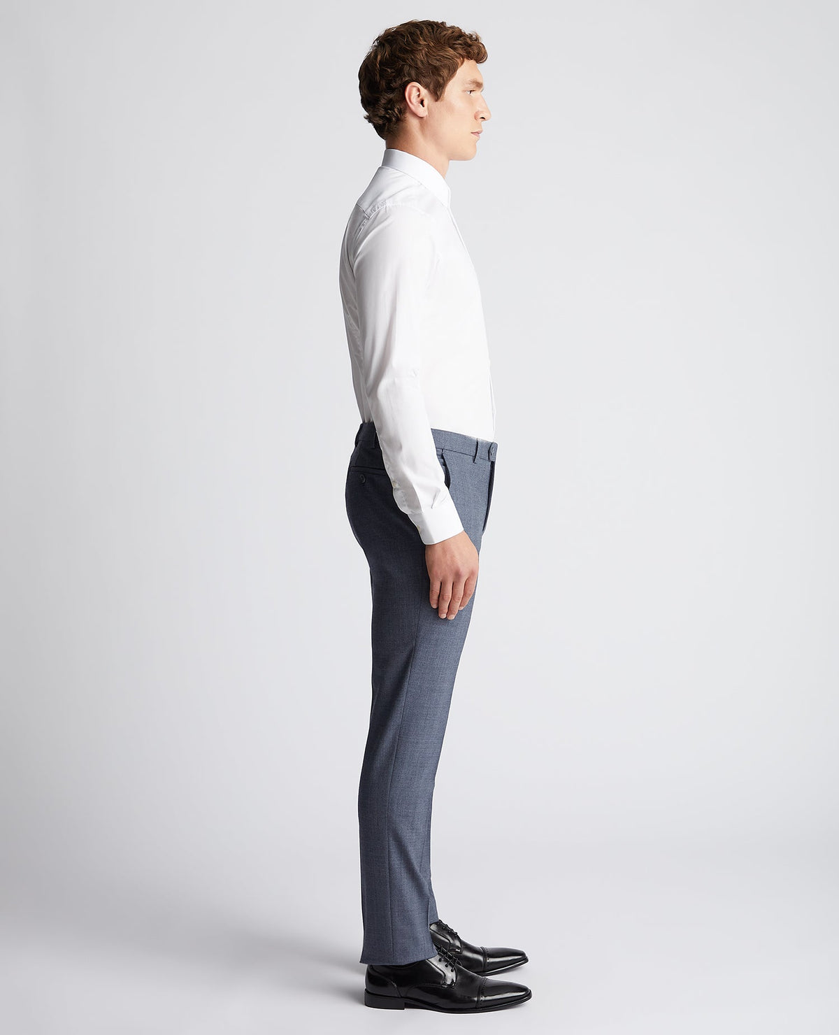 Man wearing a blue X-Slim Fit Wool Blend Mix And Match Suit Trouser