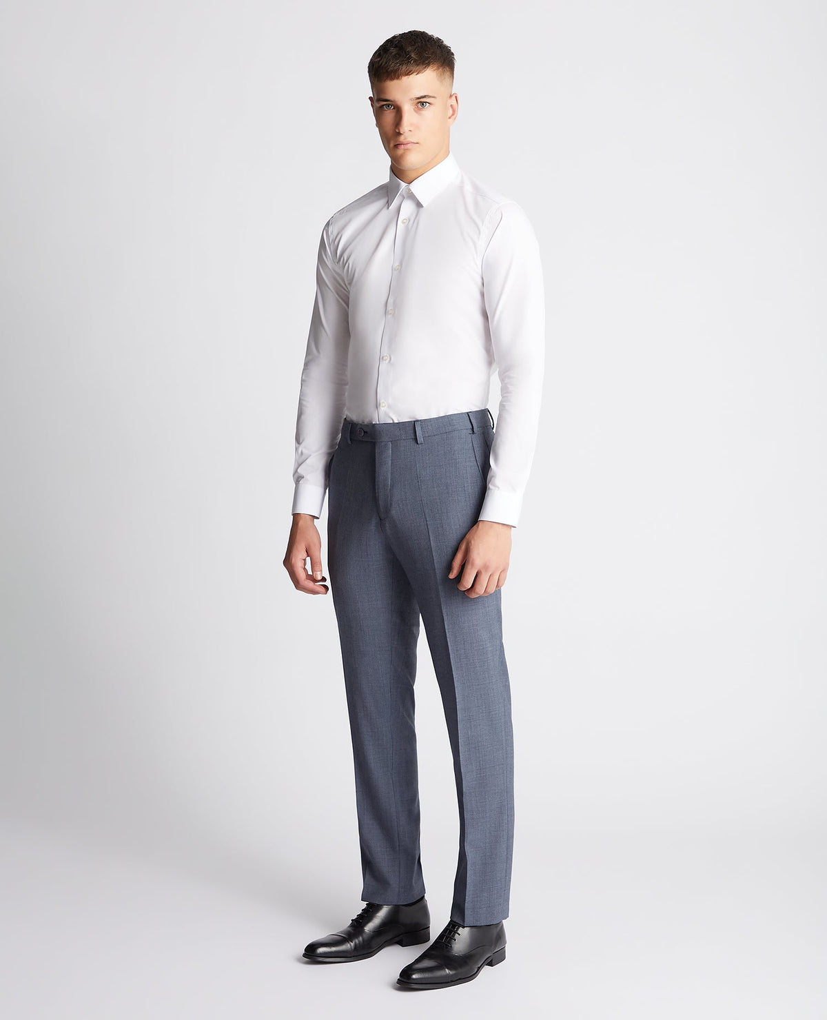 Man wearing a blue Tapered fit wool blend mix and match suit trouser