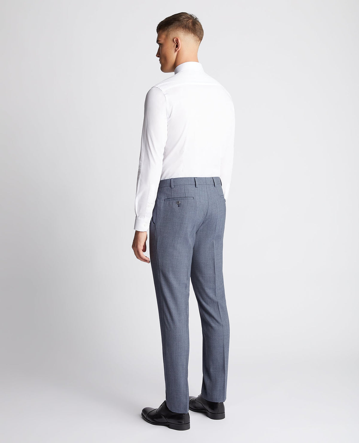 Man wearing a blue Tapered fit wool blend mix and match suit trouser
