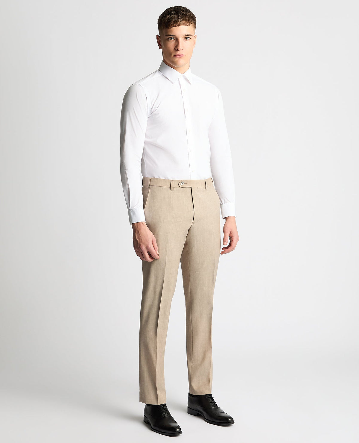 Man wearing a sand Tapered fit wool-stretch mix and match suit trouser
