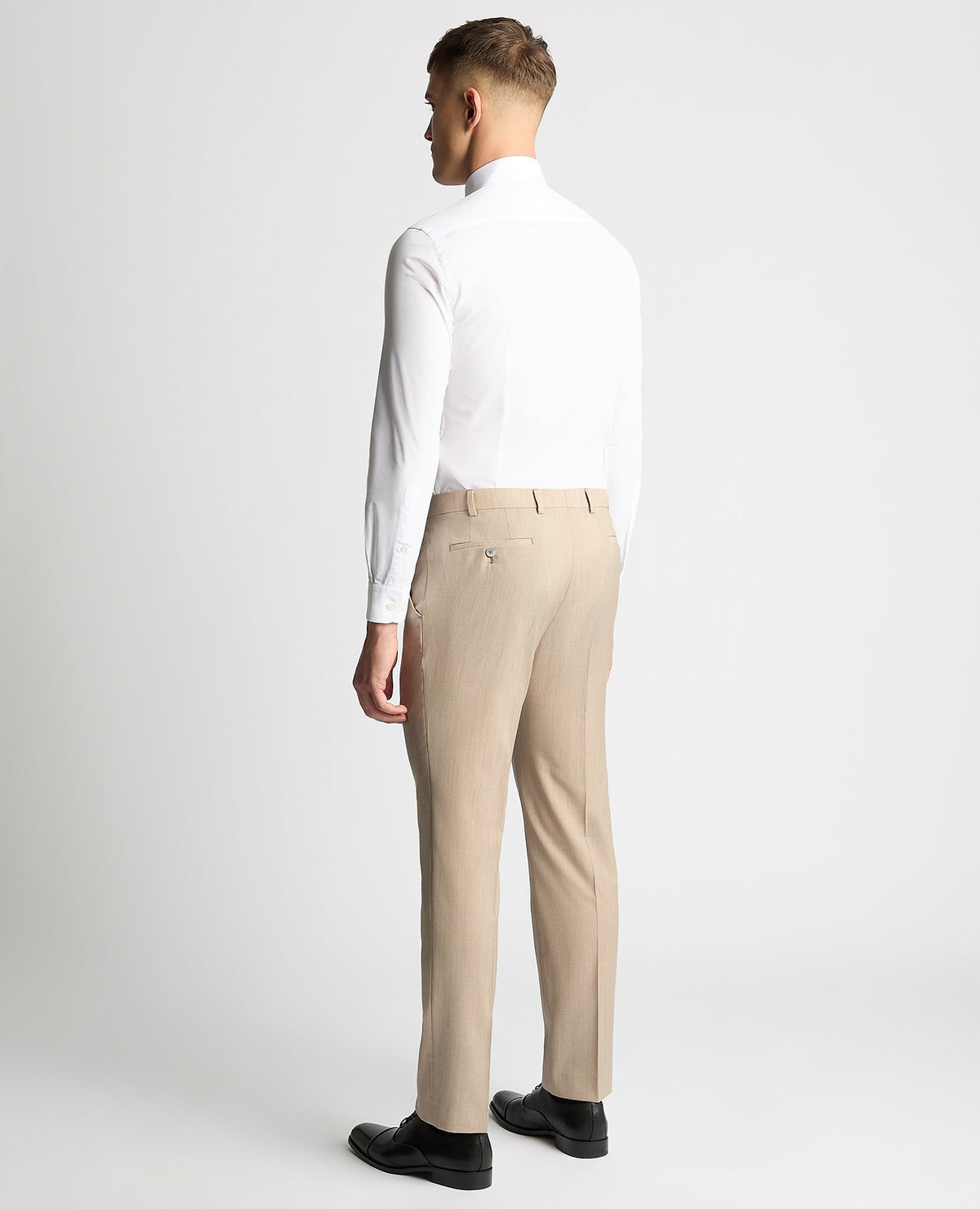 Man wearing a sand Tapered fit wool-stretch mix and match suit trouser