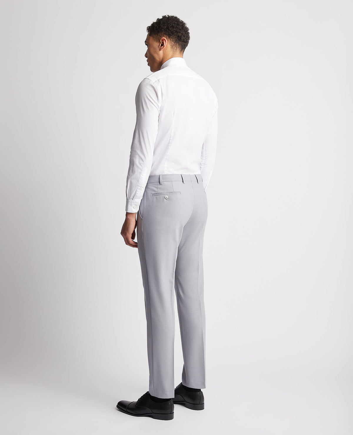 Man wearing a blue Slim Leg Wool Rich Mix and Match Suit Trouser