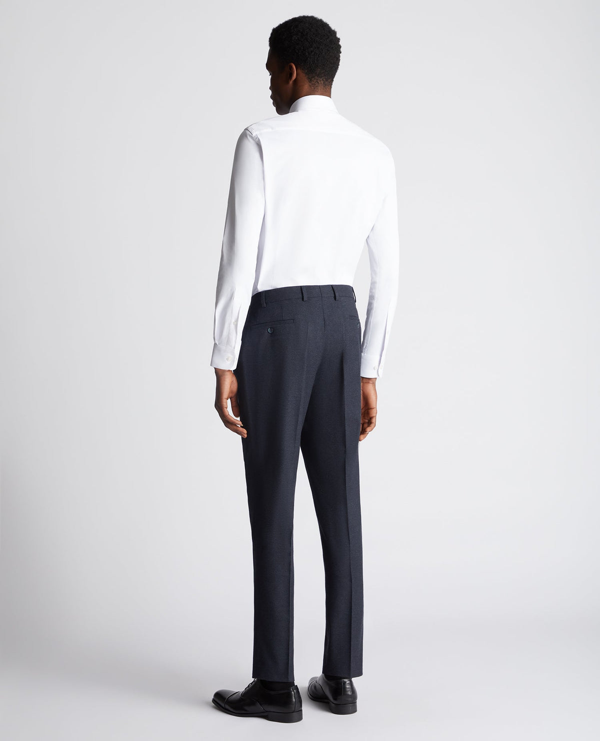 Man wearing a navy Slim Leg Stretch Formal Trousers