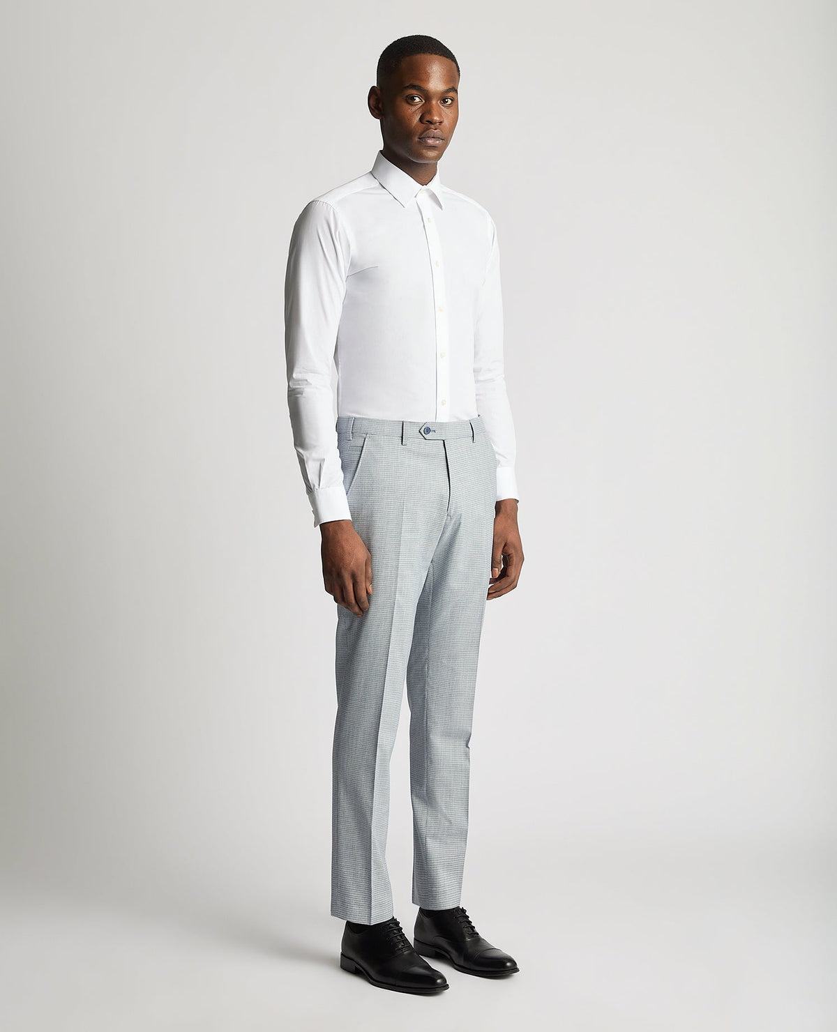 Man wearing a blue Slim Leg Stretch Formal Trousers