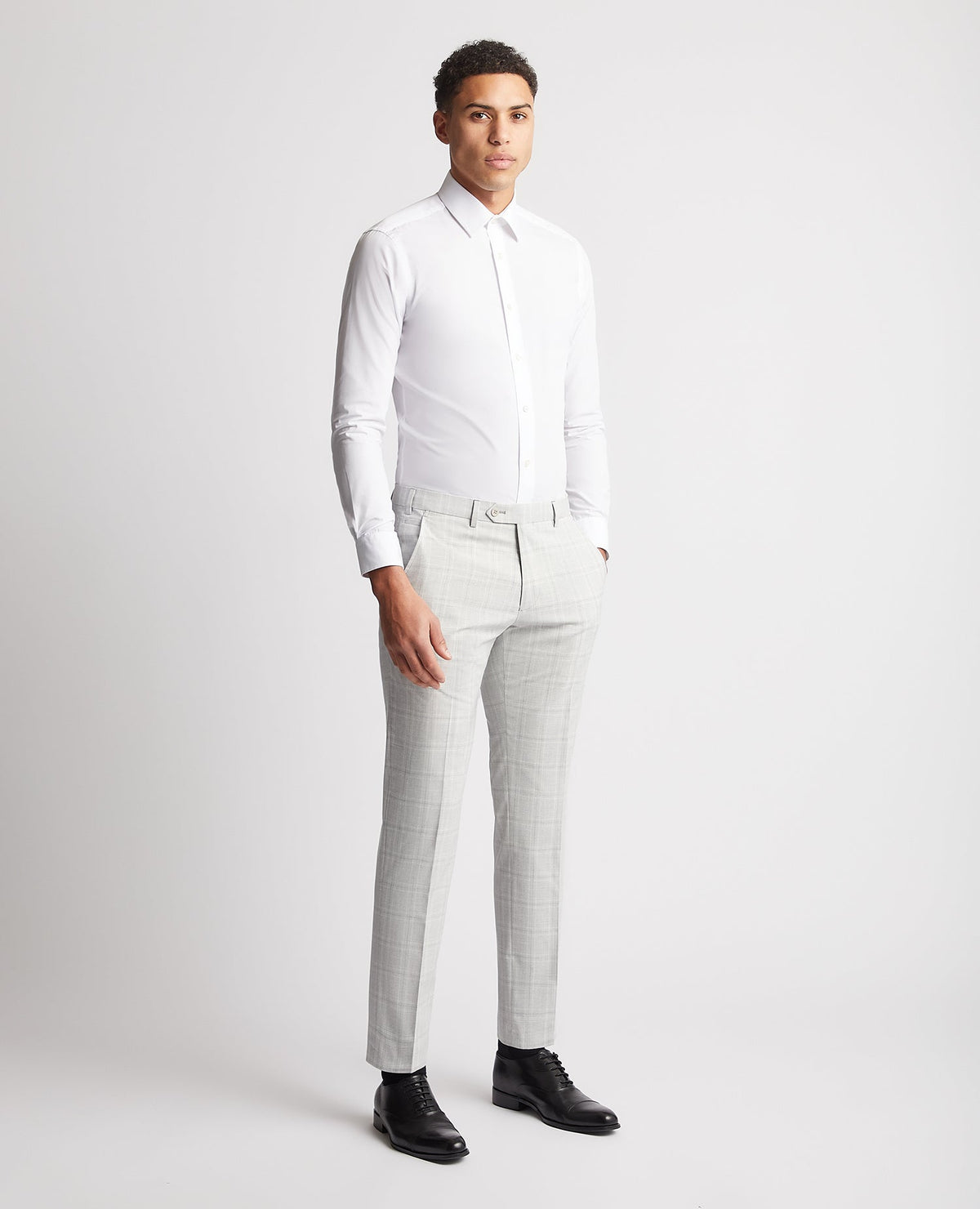 Man wearing a grey Checked Stretch Formal Trousers