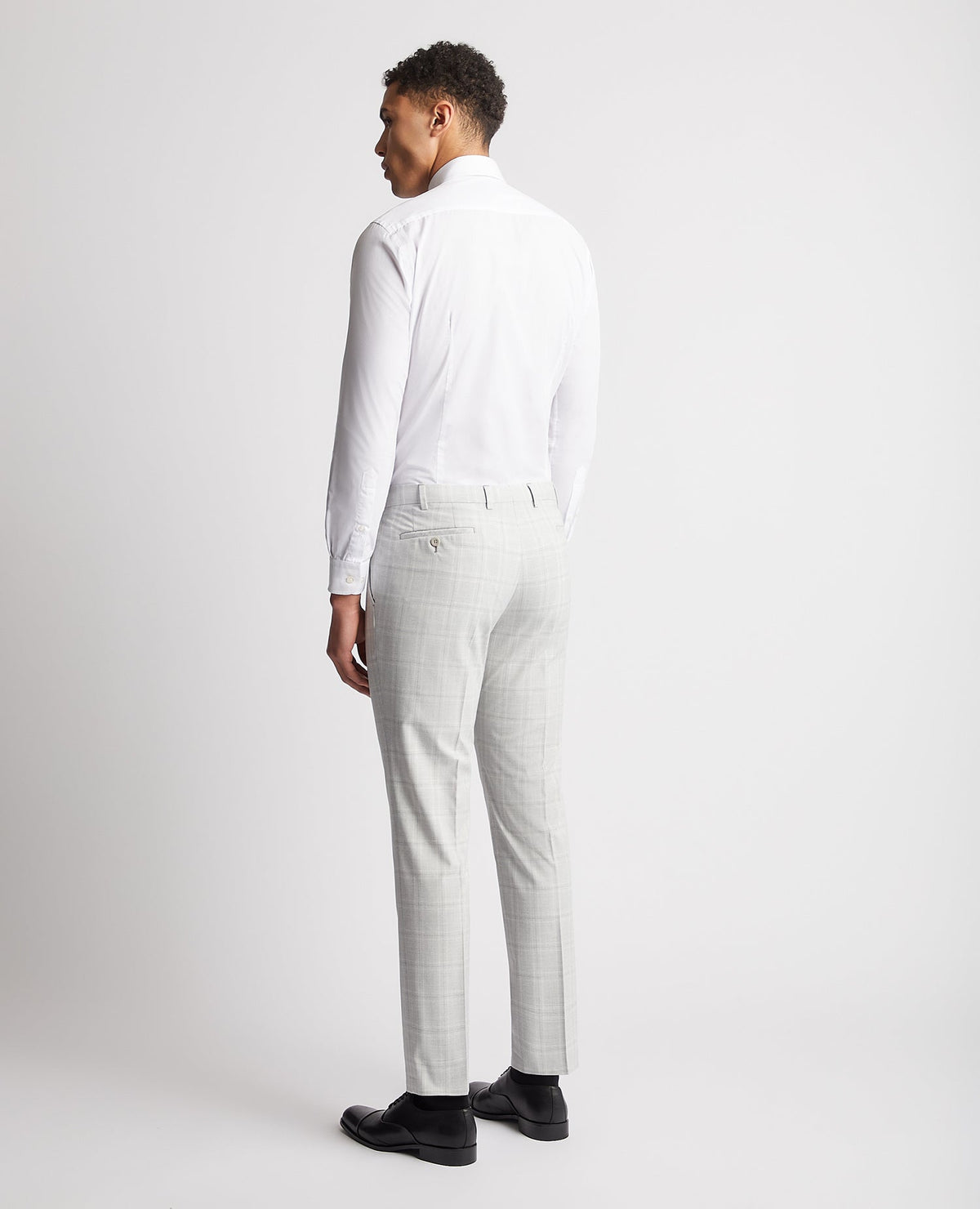 Man wearing a grey Checked Stretch Formal Trousers