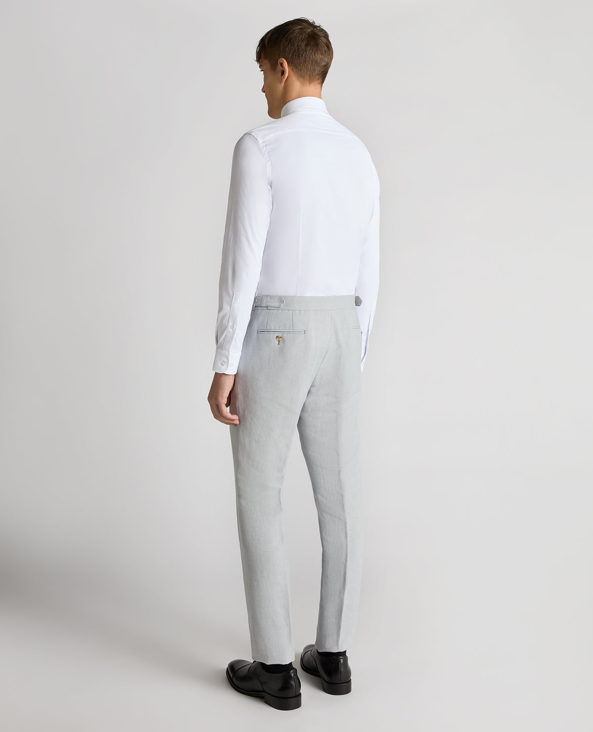 Man wearing a blue Slim Leg Linen-Blend Formal Trousers