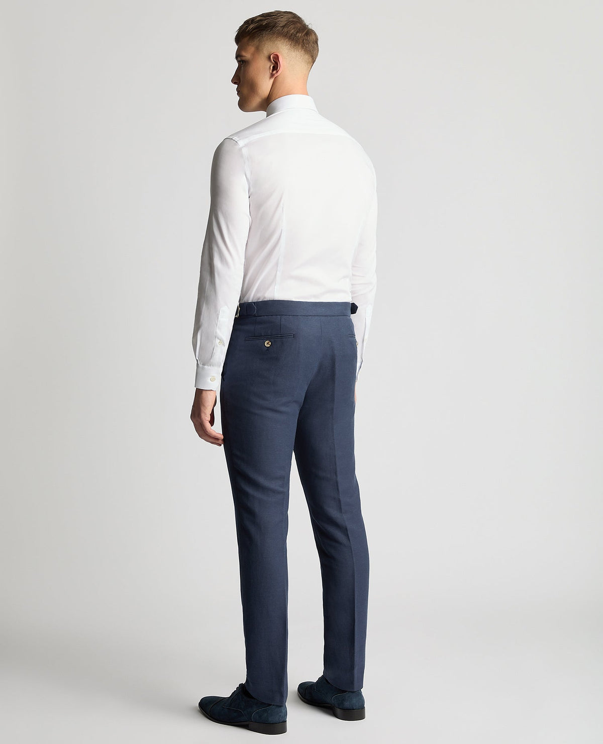 Man wearing a blue Slim Leg Linen-Blend Formal Trousers