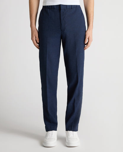 Man wearing a blue Slim Leg Linen-Blend Trousers