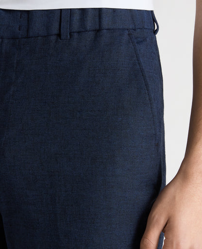Man wearing a blue Slim Leg Linen-Blend Trousers